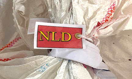 5 ballot paper bags which were sealed with NLD Party logoed labels